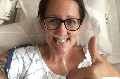 Kelly in hospital bed